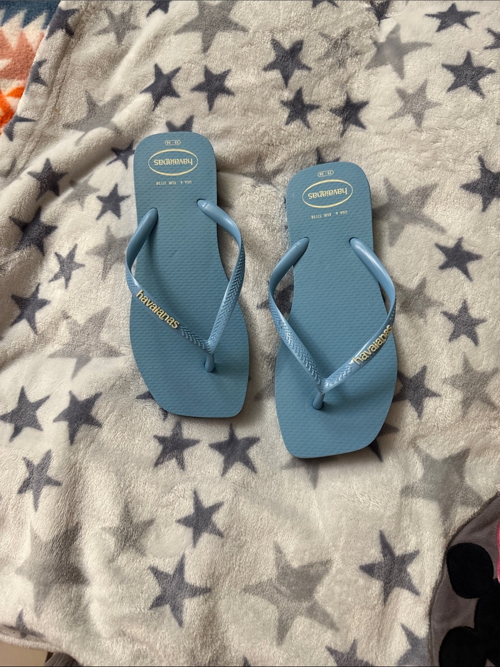 Havaianas Slim Flip Flops in Sky Blue with Gold Logo